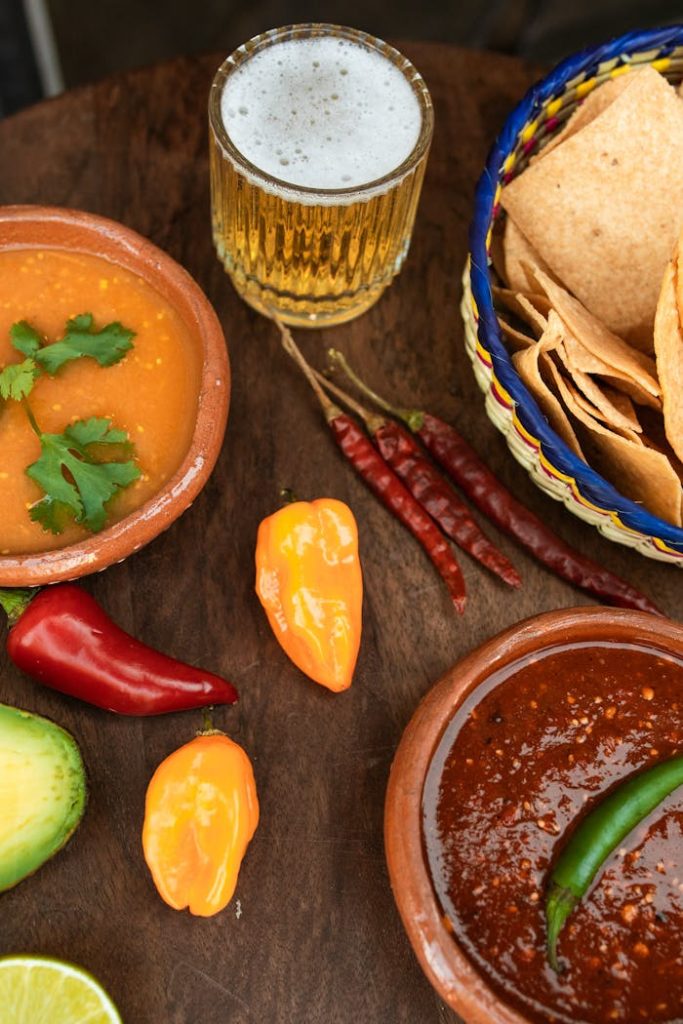 Assorted Chilies on Brown Wooden Table